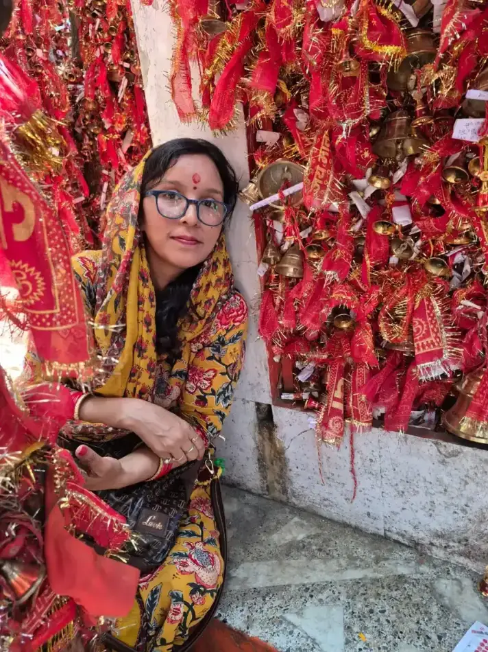 Brass bells and red prayer ribbons at the Golu Devta temple, Ghorakhal