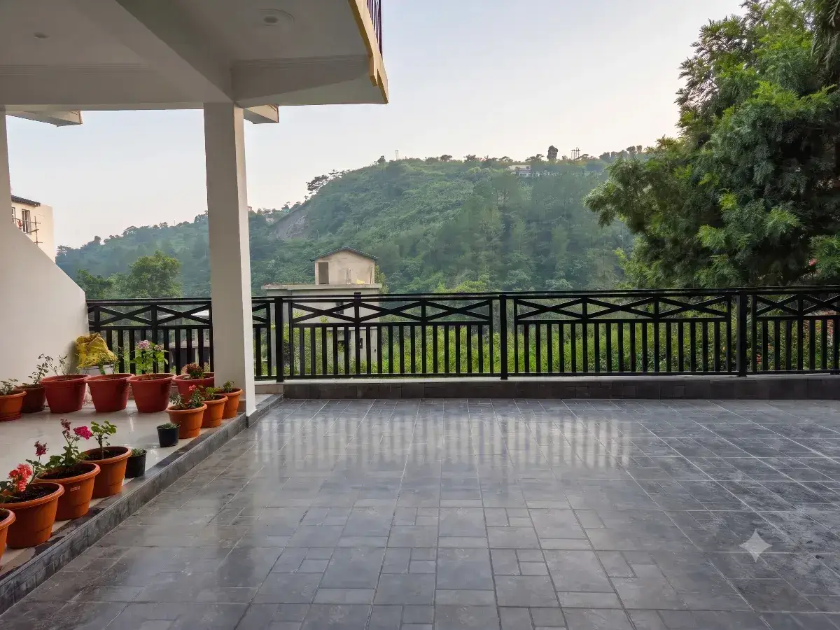 Terrace view over the Kumaon hills from Blessed Aura
