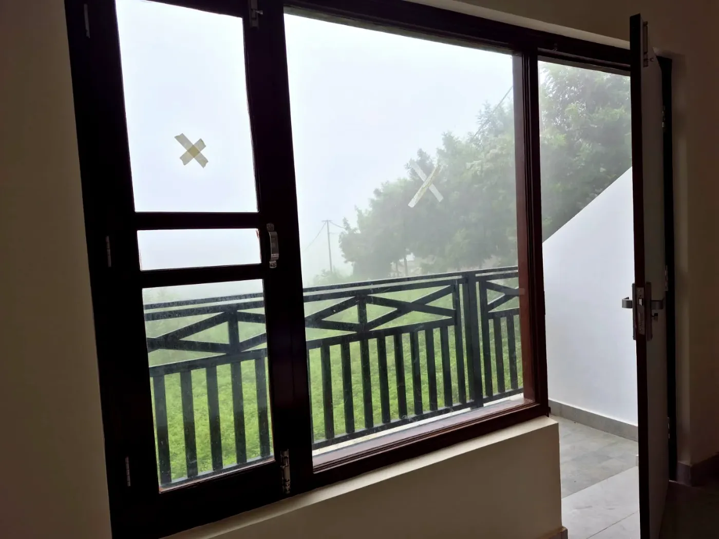 Balcony seating with a hillside view