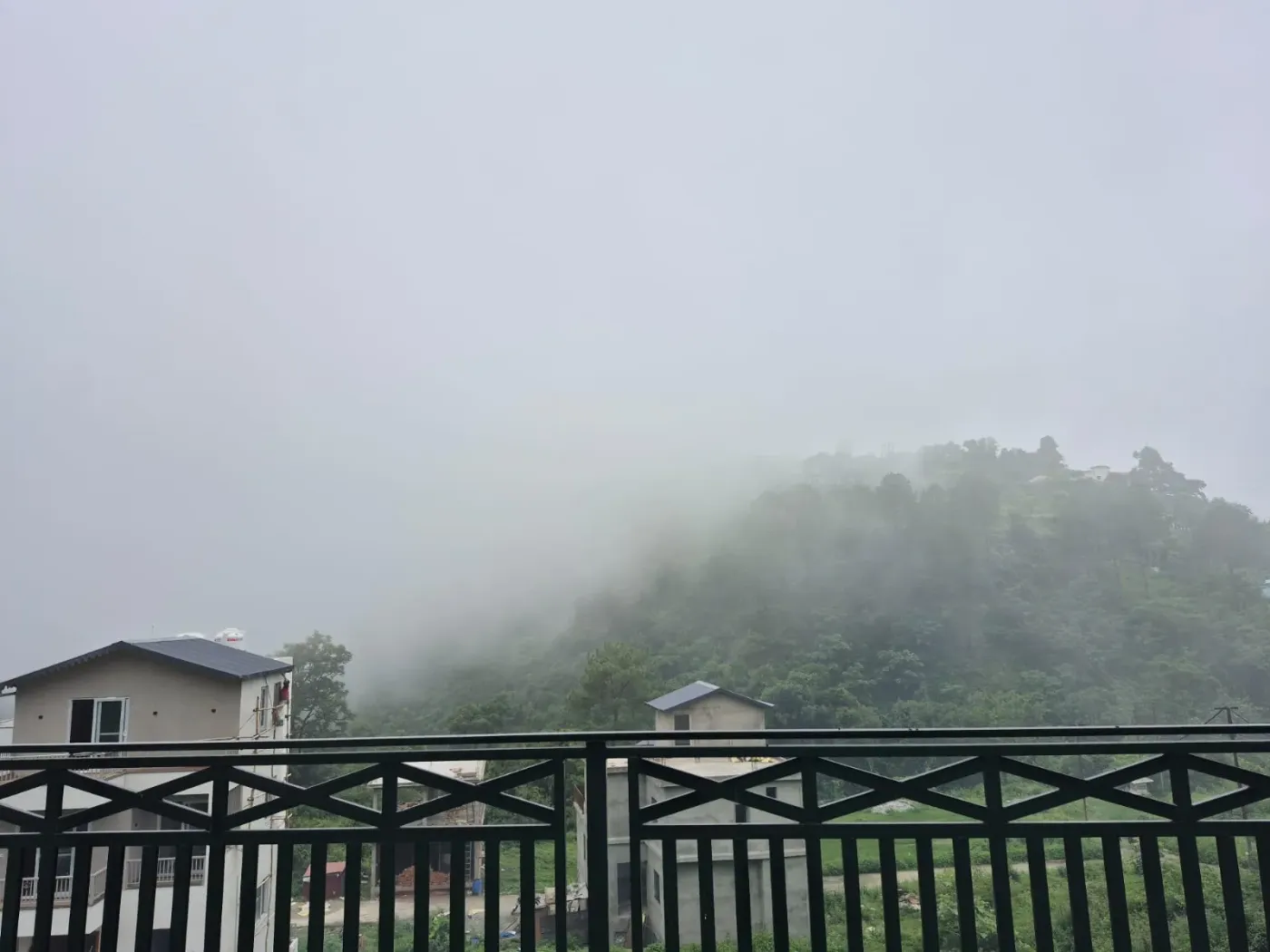 Misty valley and village below the property